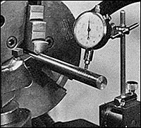 Indicating piece in lathe with  large dial indicator